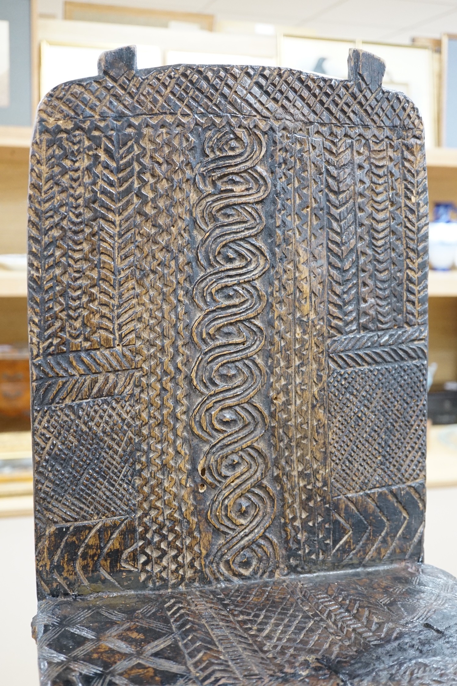 An African tribal carved hardwood chair, possibly Congo. 76cm tall